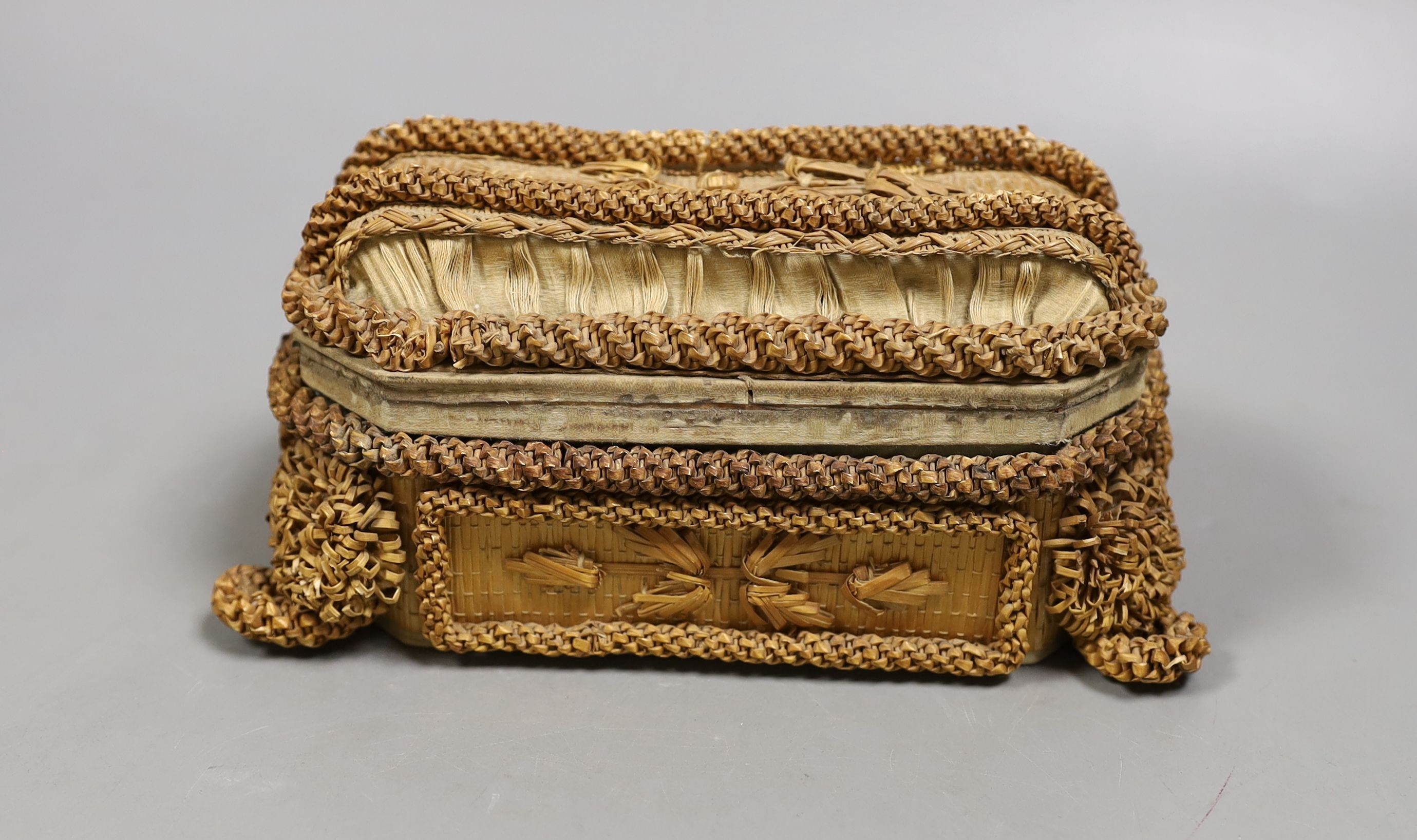 A small 19th century straw work casket., 17cms wide x 9cms high.